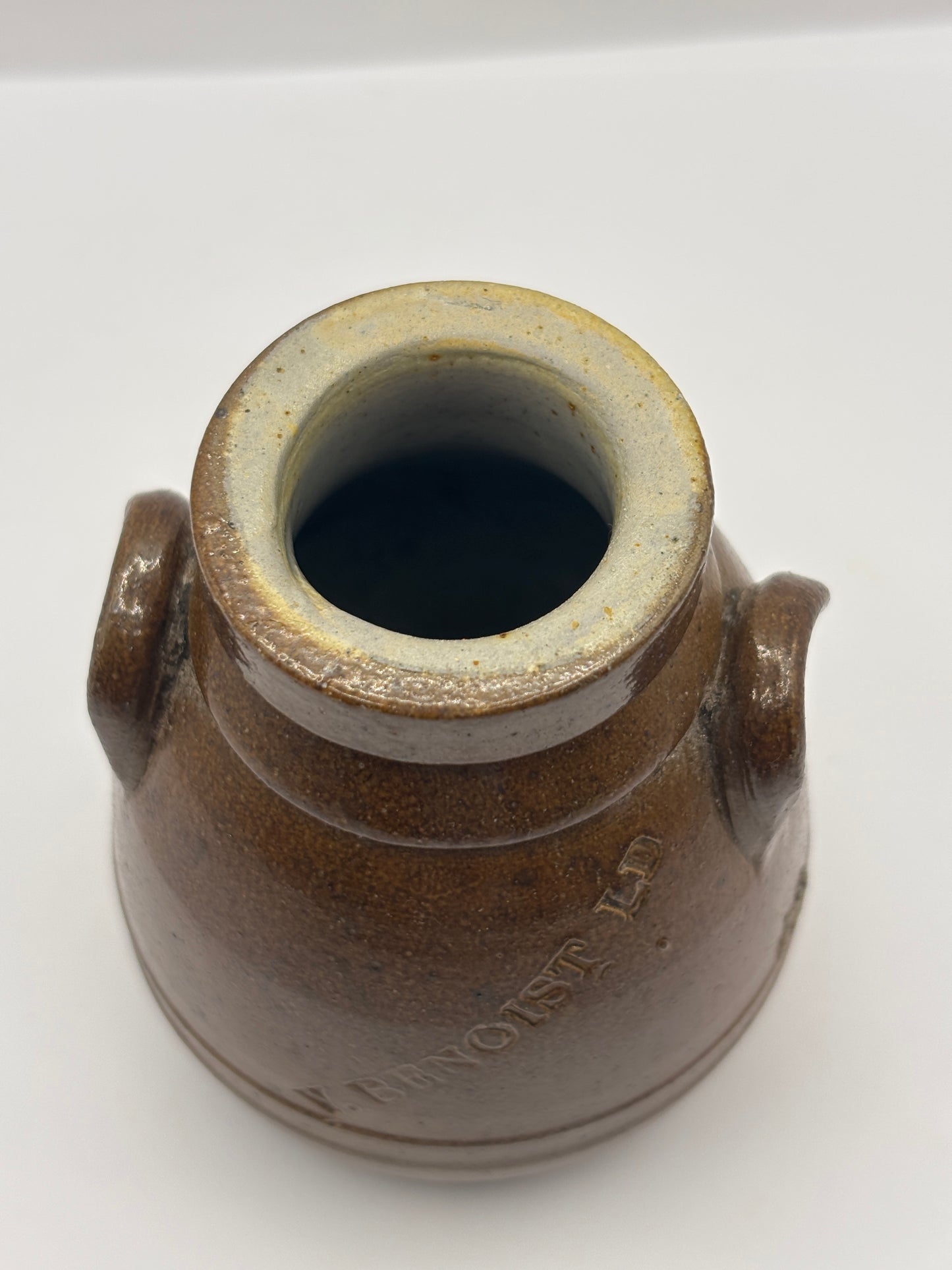 Old brown stoneware Benoist jar