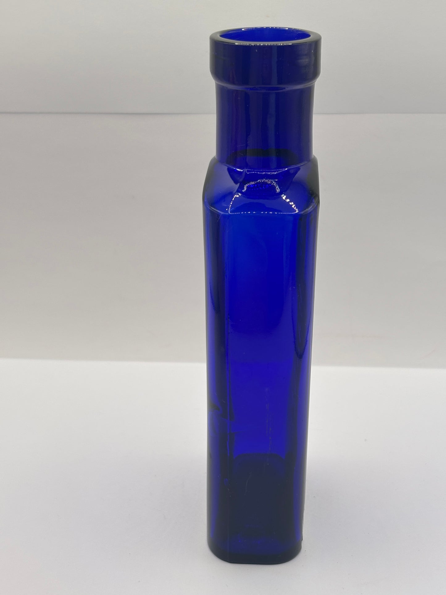 Old blue glass advertising bottle, Granular citrate of magnesia