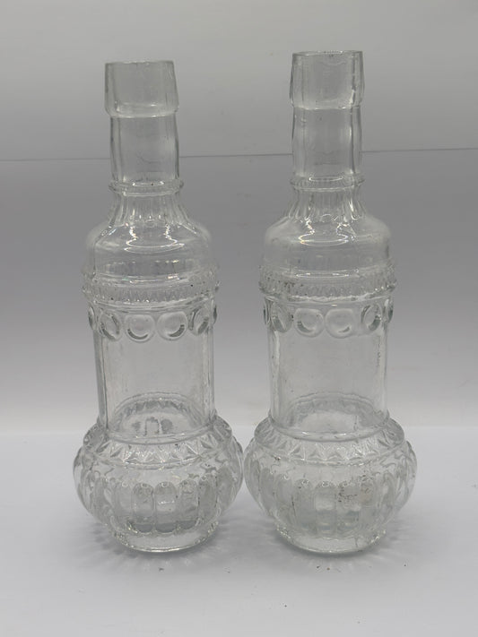 2 old clear glass bottles, soda?