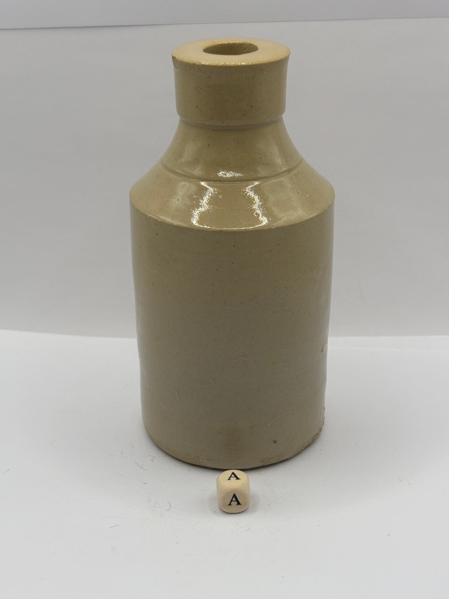Old stoneware Fish & Ring brand advertising bottle (a)