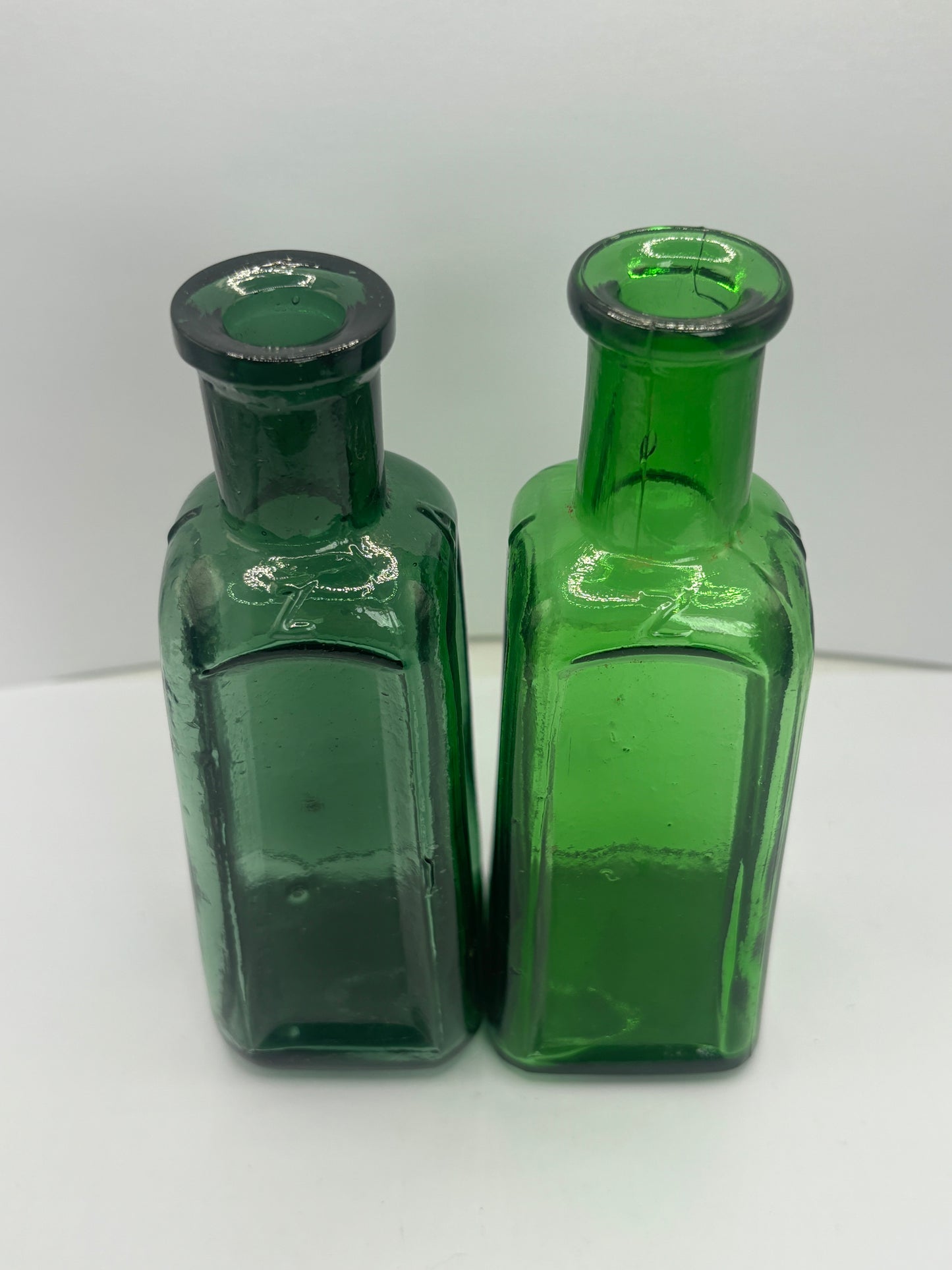 2 old green Izal bottles