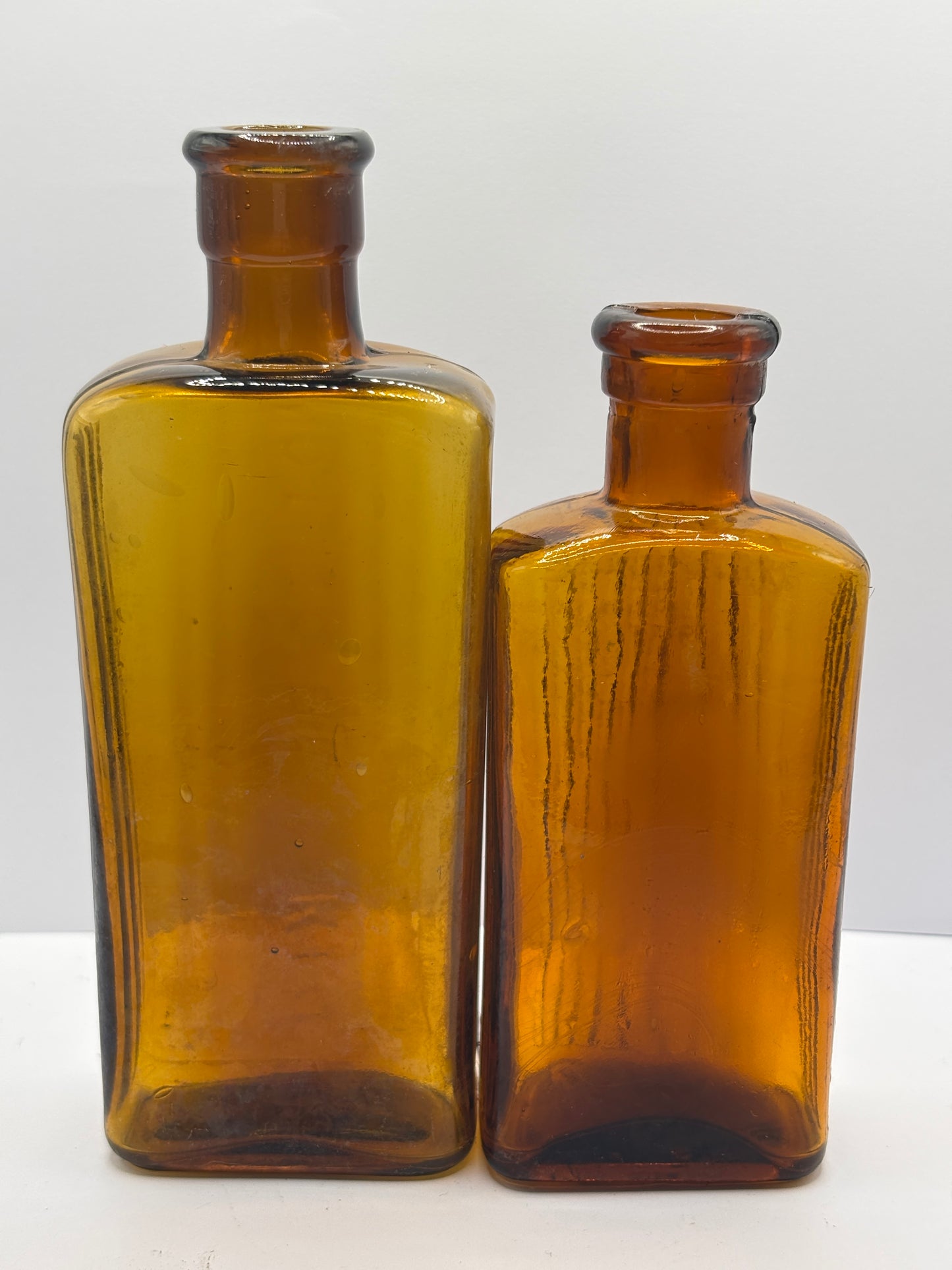 2 old amber glass poison bottles, not to be taken