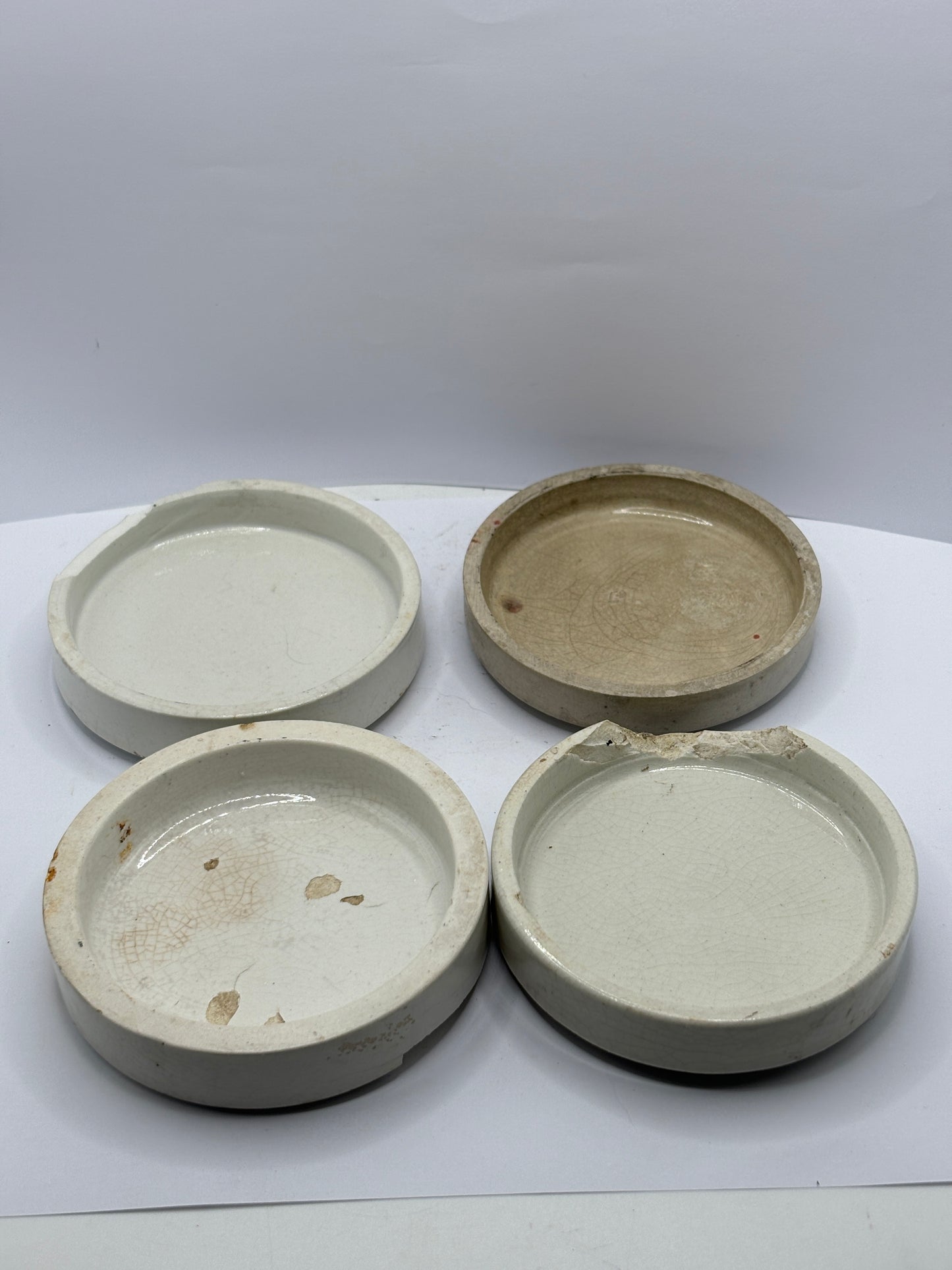 4 damaged advertising lids