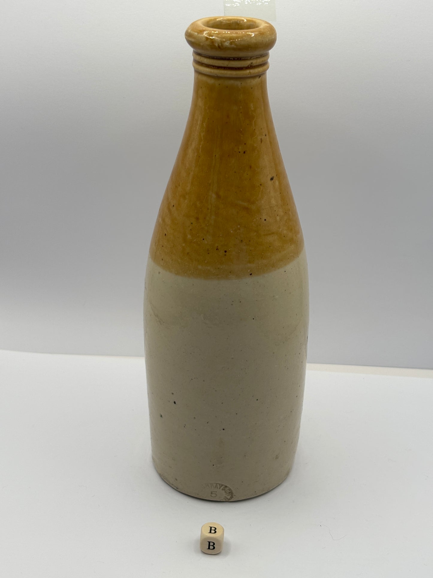 Old plain stoneware ginger beer bottle (B)