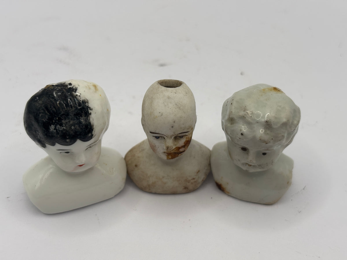 3 small crusty old dolls heads (1 x damaged)