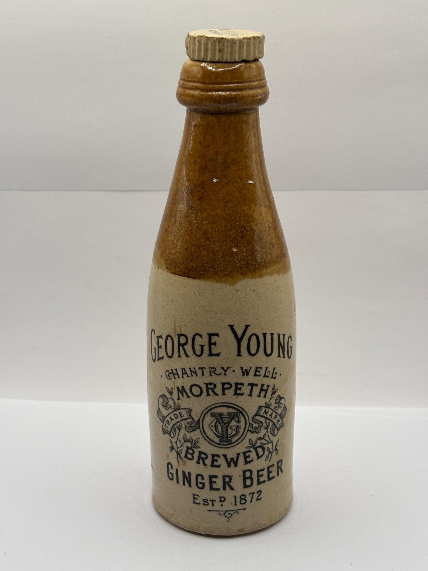 Old stoneware ginger beer bottle, George Young. Morpeth brewed ginger beer. Original stopper