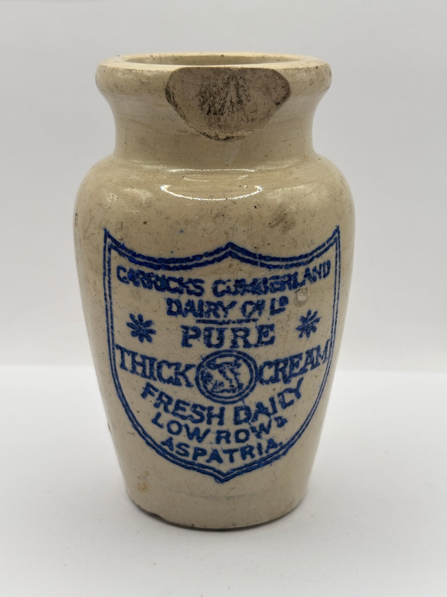 Old advertising cream pot, Carricks pure thick cream. Damaged