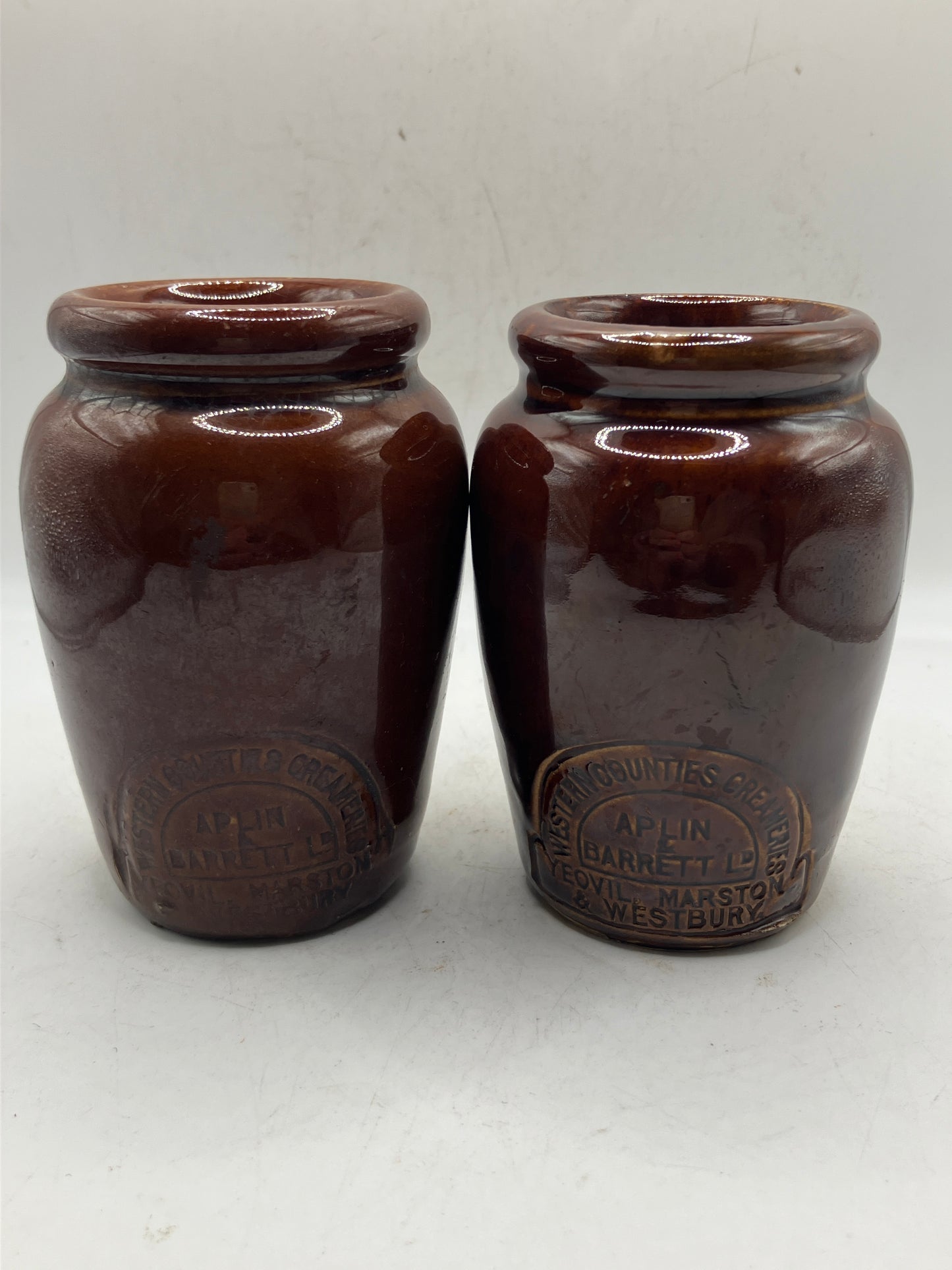 2 brown stoneware cream pots, western countries creameries