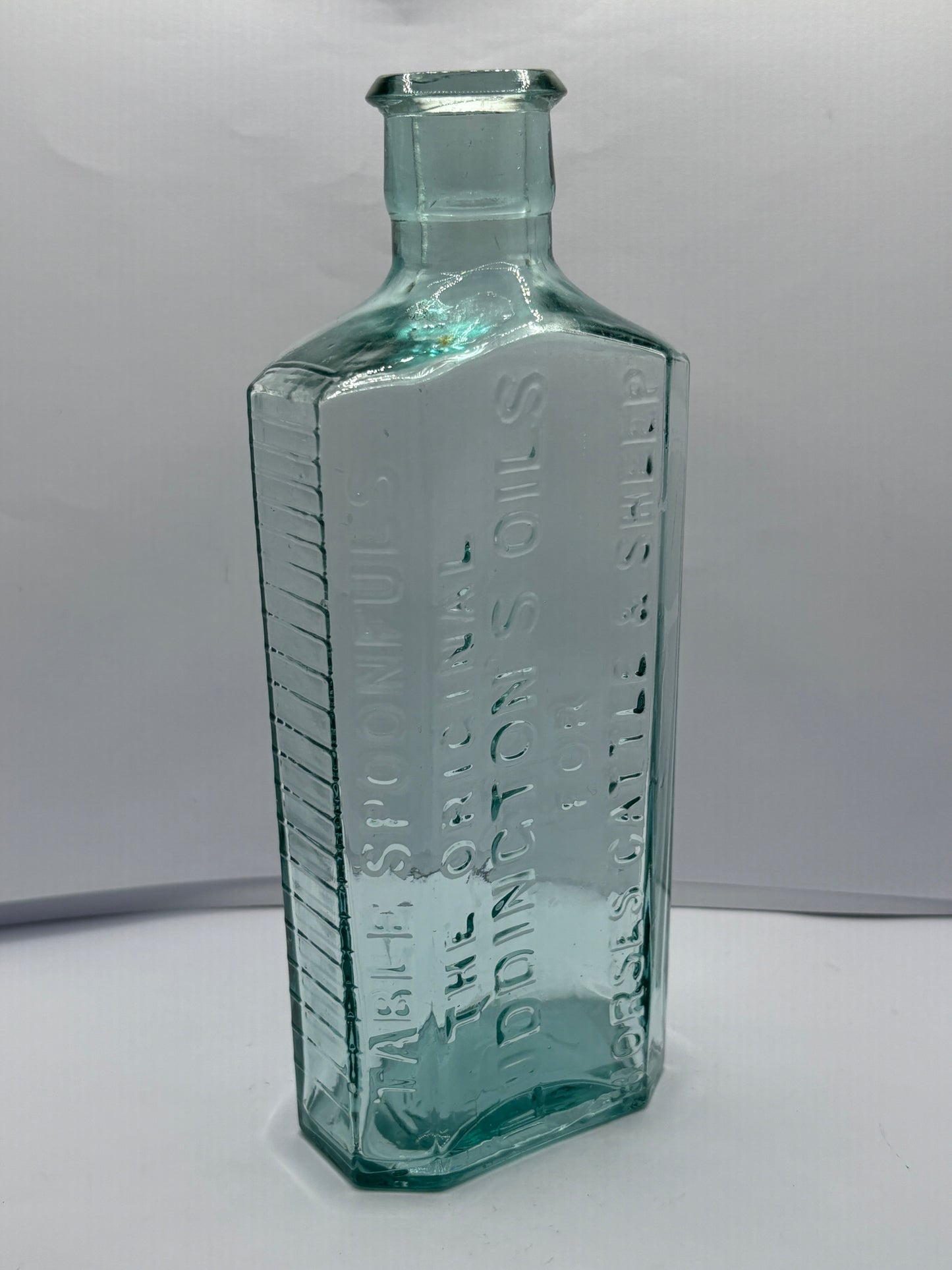 Old aqua glass vets bottle, luddingtons oils for horses cattle & sheep