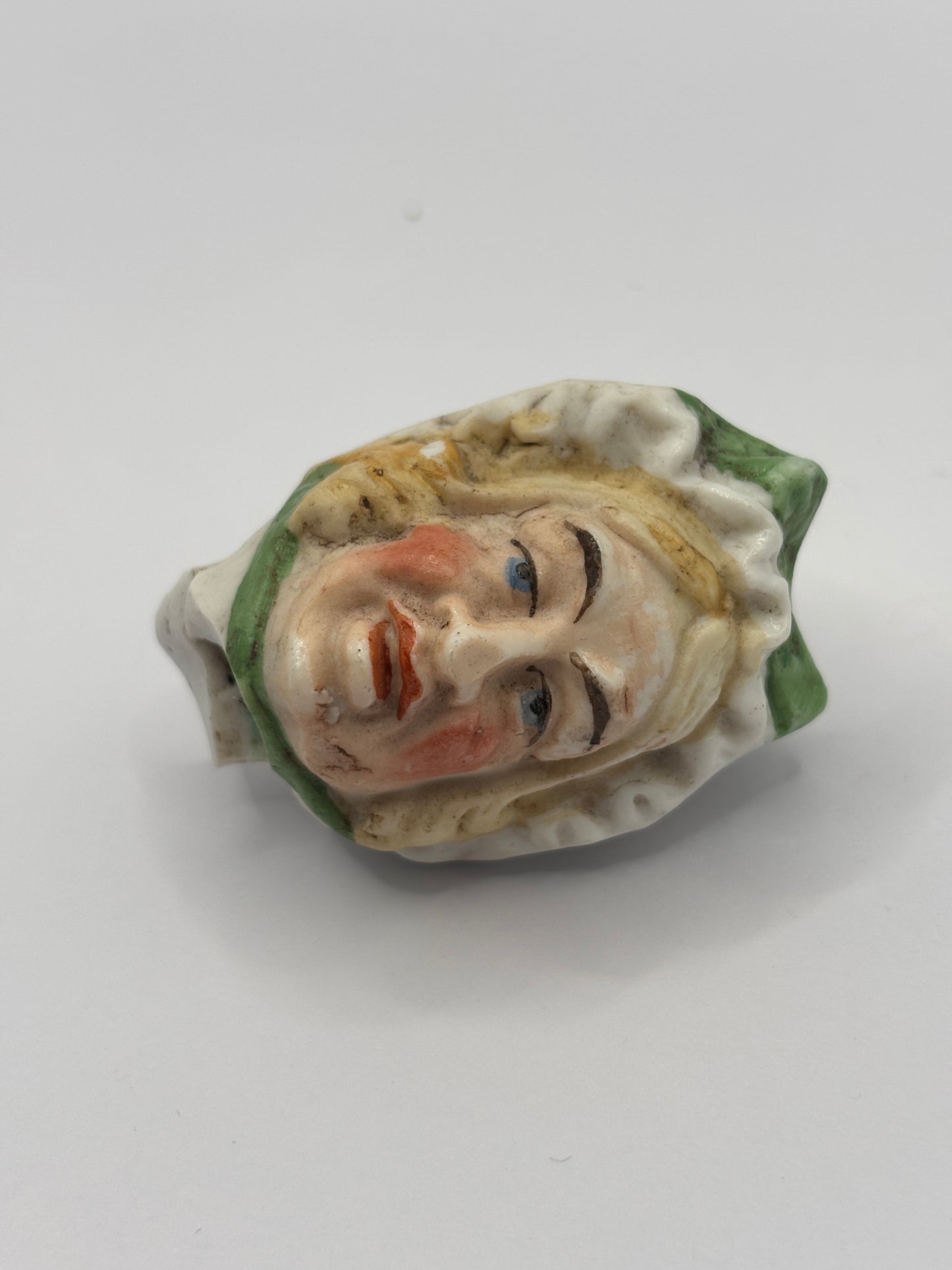 Old dolls head, damaged