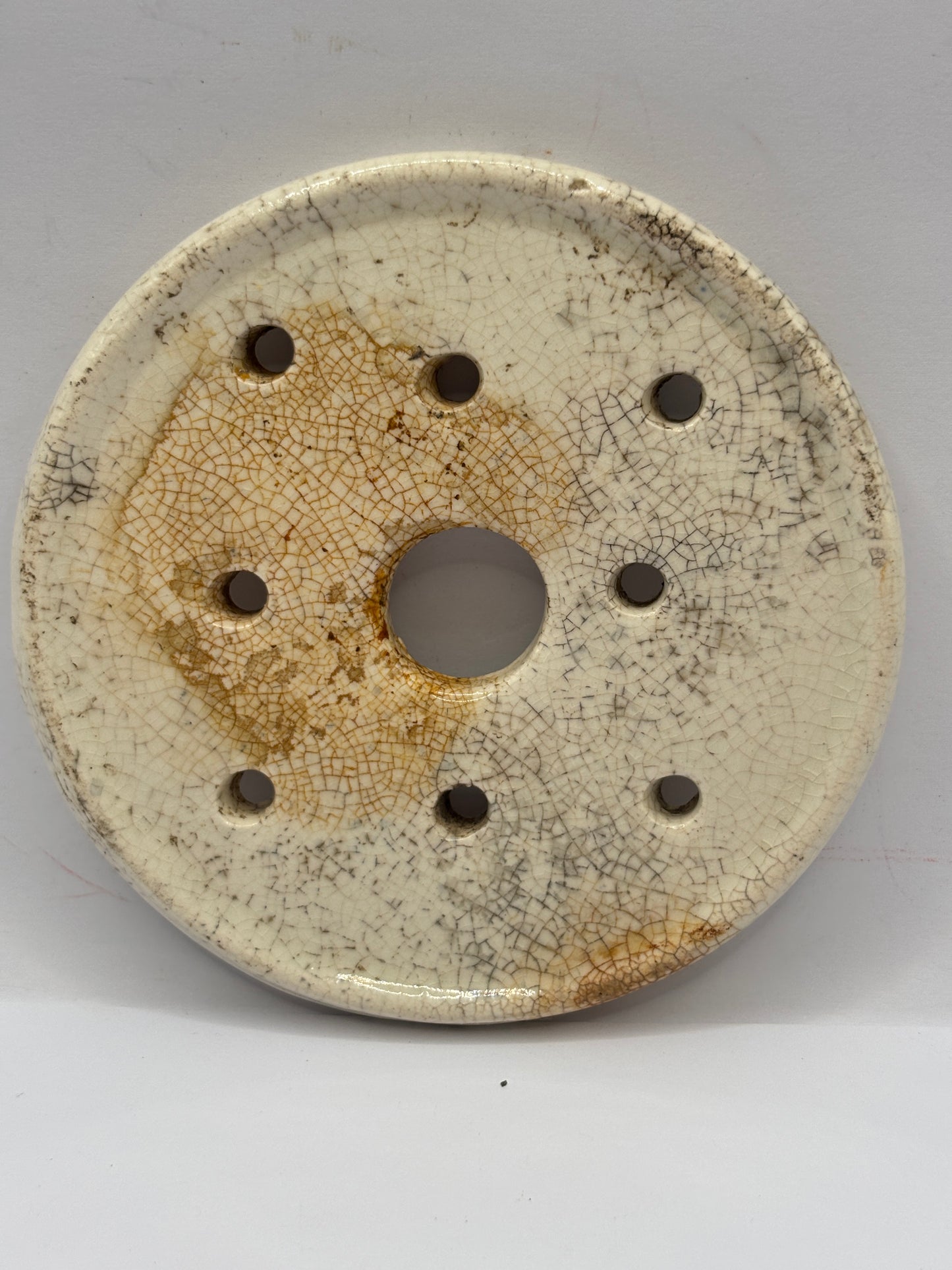 Old stoneware strainer, stained & crazed