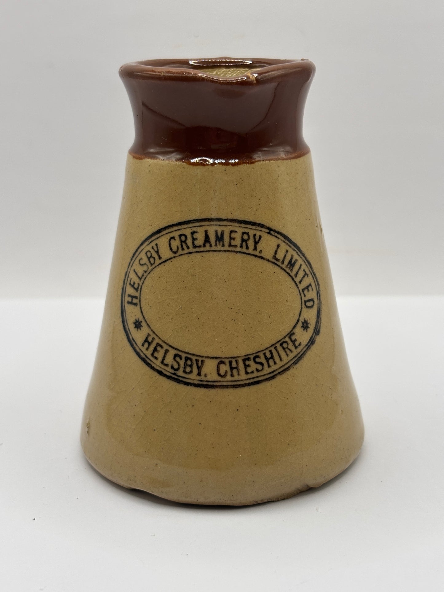 Old stoneware advertising cream pot, Helsby Creamery. Cheshire. Handled