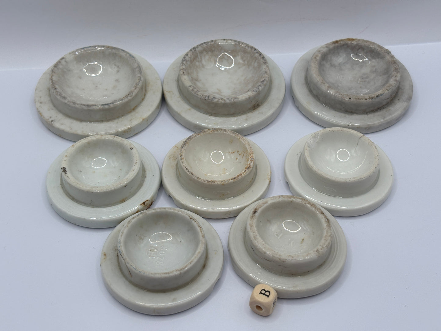 8 stoneware lids, stacking lids