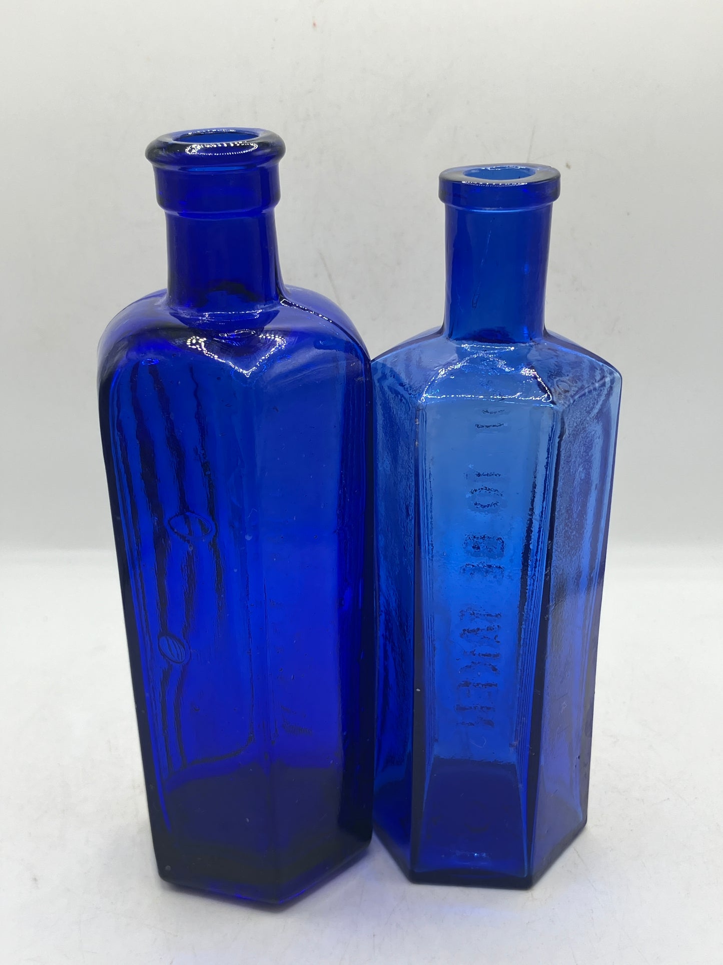 2 blue glass ribbed poison bottles, Not to be taken