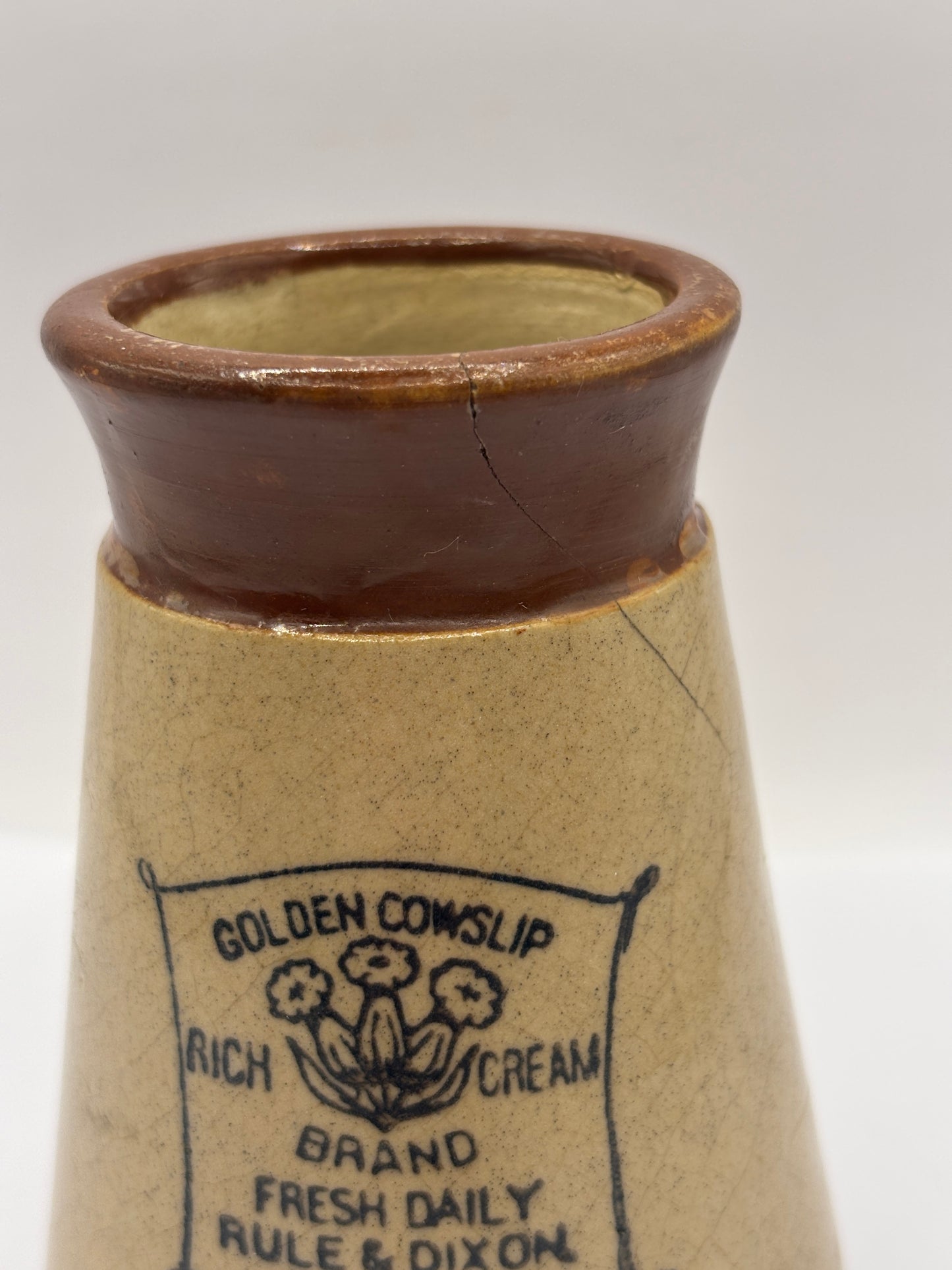 Old advertising cream pot, Cowslip (c) repaired/damaged