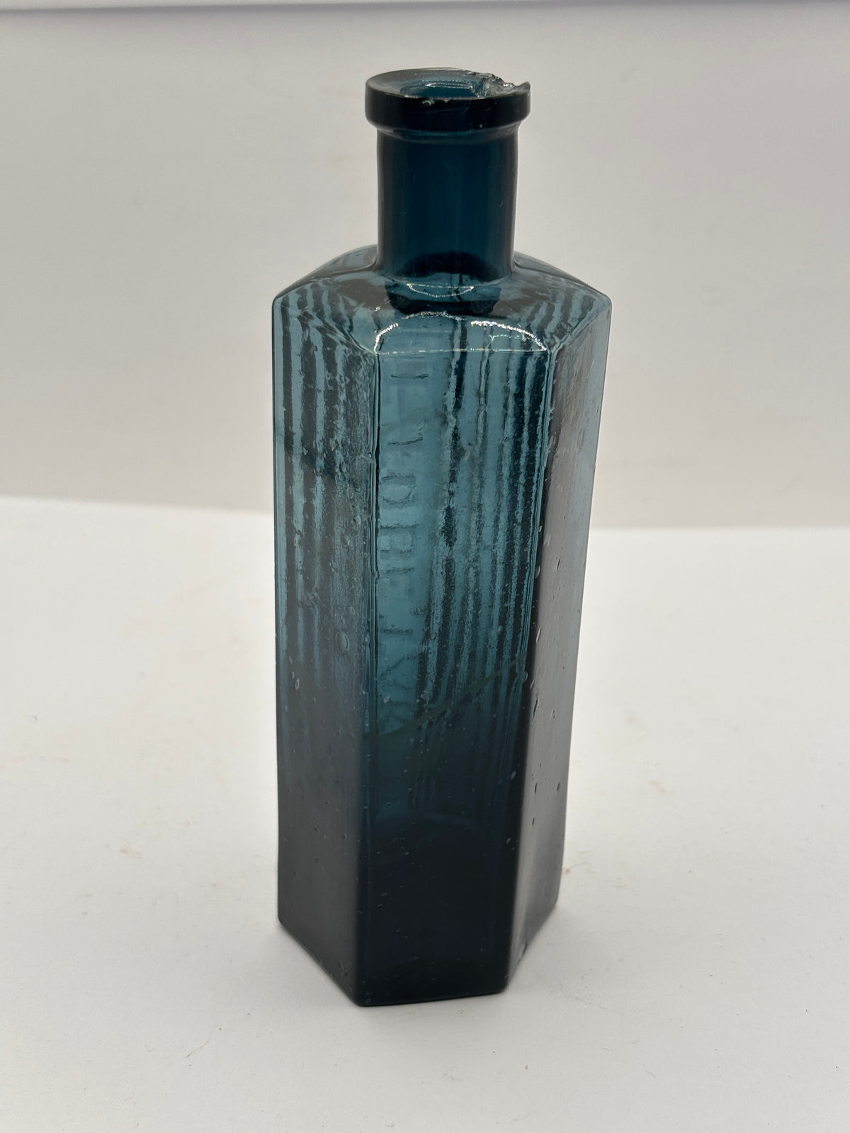 old blue glass ribbed poison bottle, not to be taken. Unusual colour