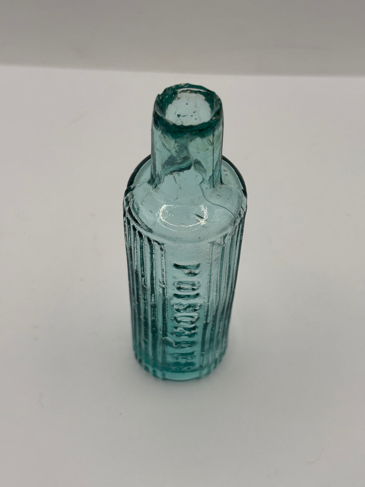 Old aqua glass poison bottle, POISONOUS not to be taken