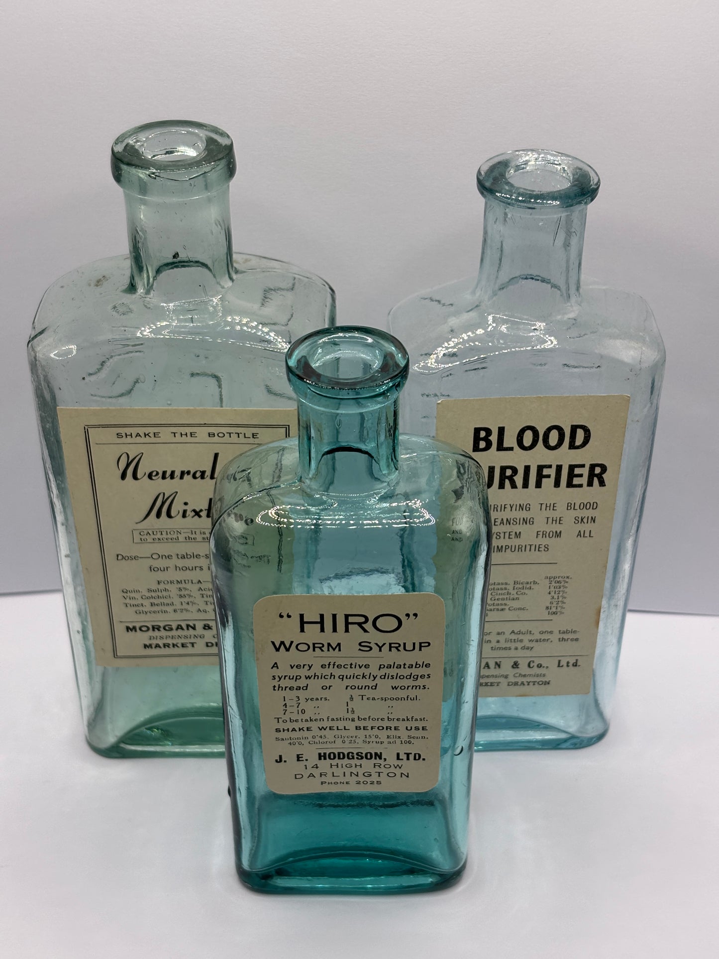 3 old chemist bottles with added chemist labels