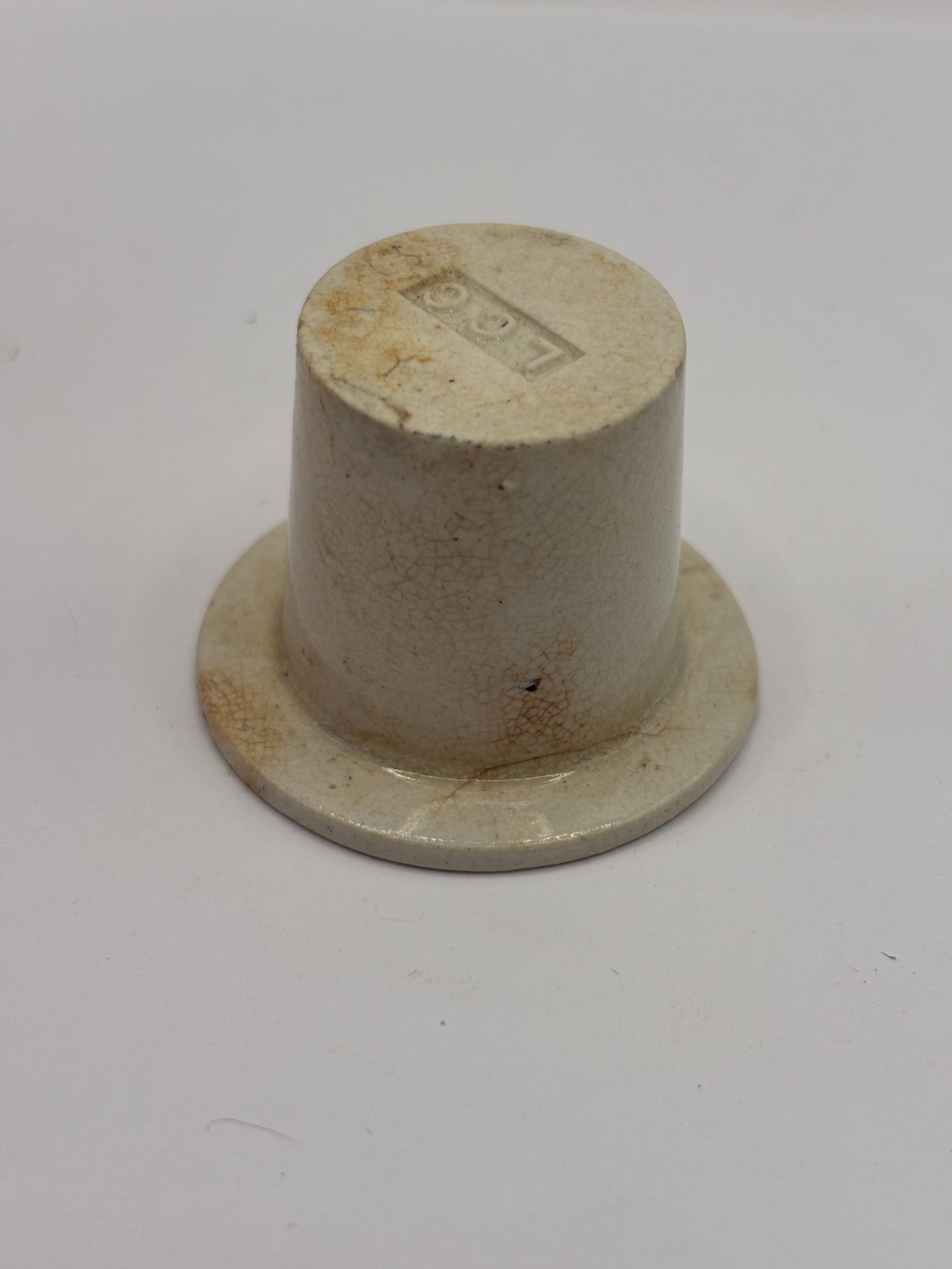 Old white stoneware school desk inkwell