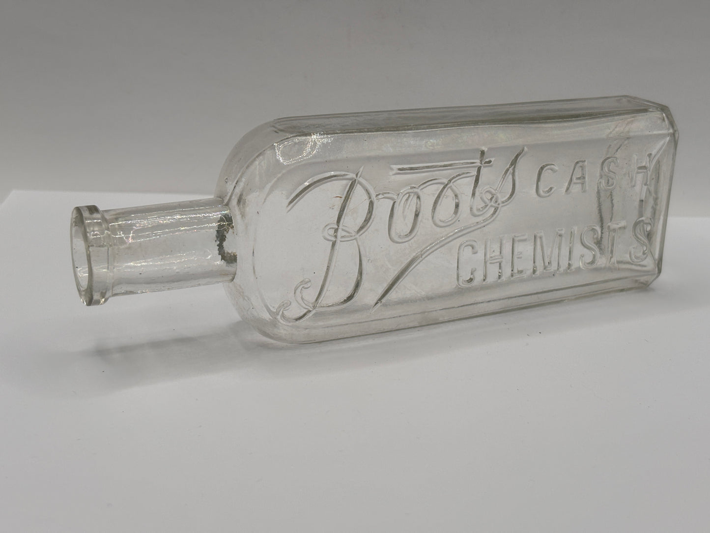 Old clear glass Boots cash chemists bottle