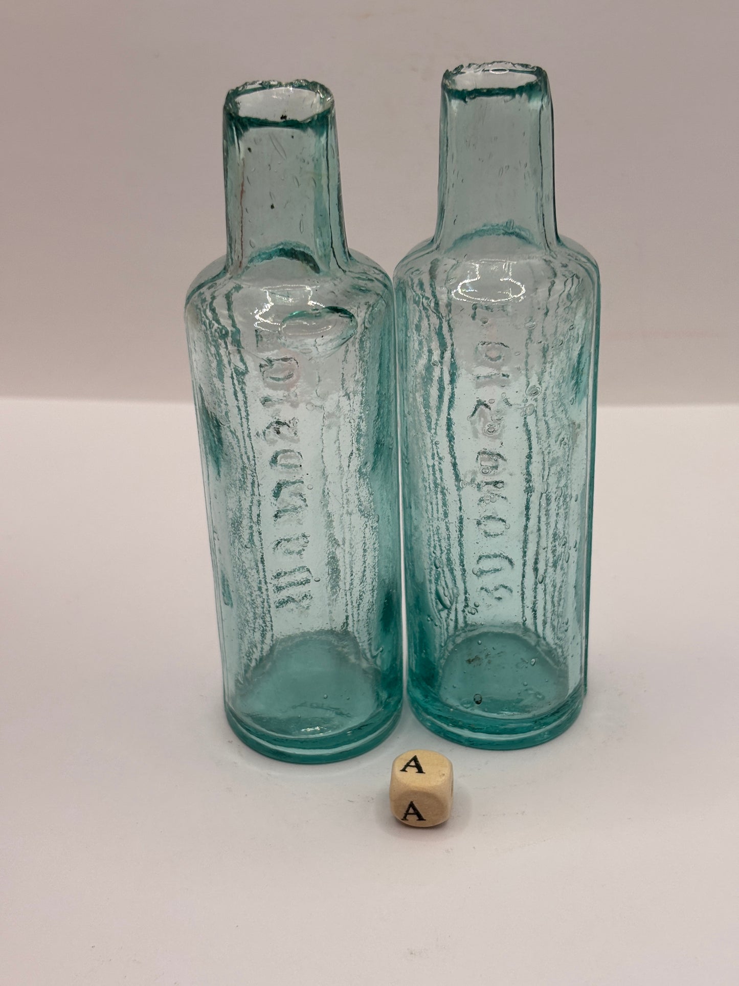2 old aqua glass poison bottles, POISONOUS (a)