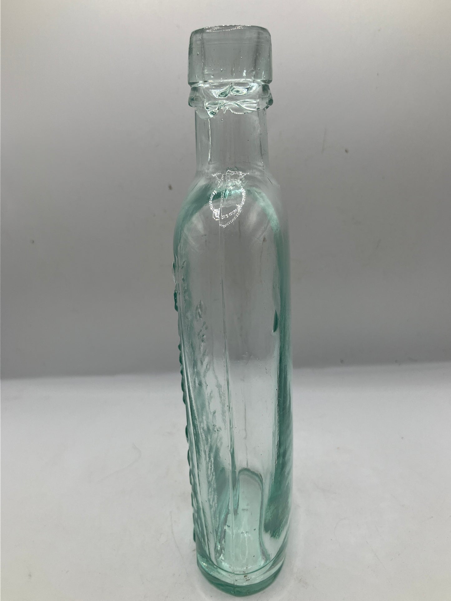 Aqua glass advertising spirit flask, Skipton