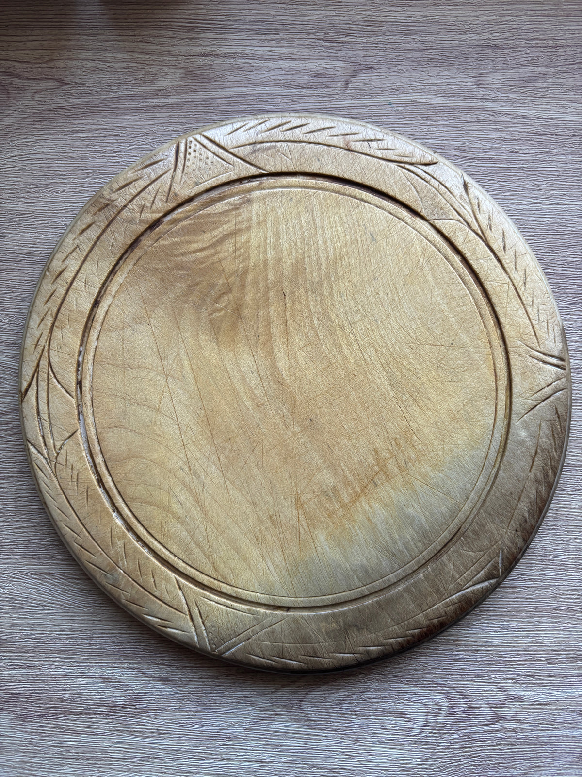 Old wooden carved bread board