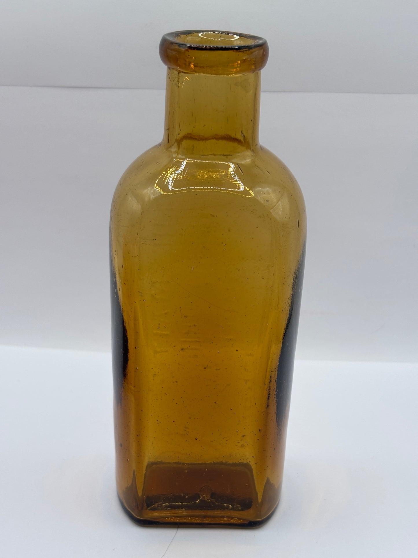 Old amber glass advertising chemist bottle, The Maltine manufacturing company