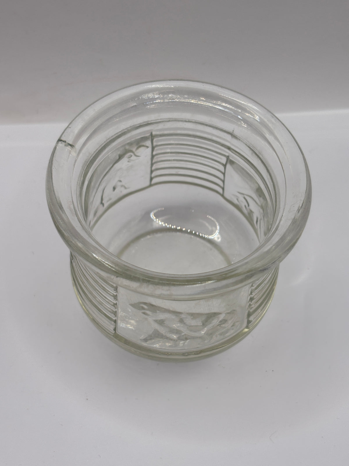 Old clear glass honey pot, bears