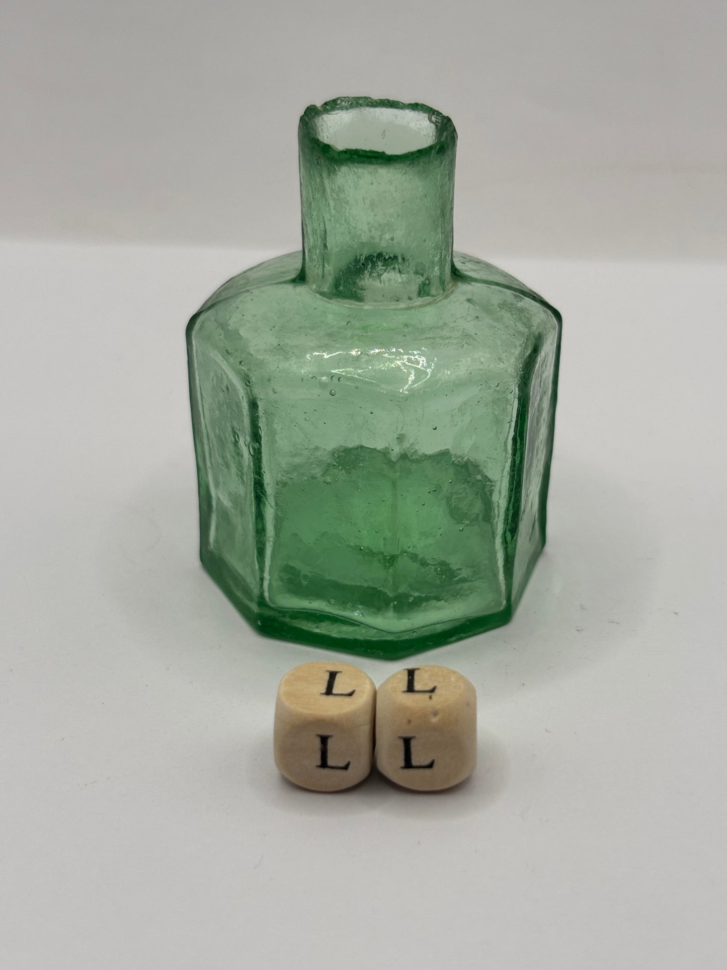 Old green glass ink, inkwell. (LL)