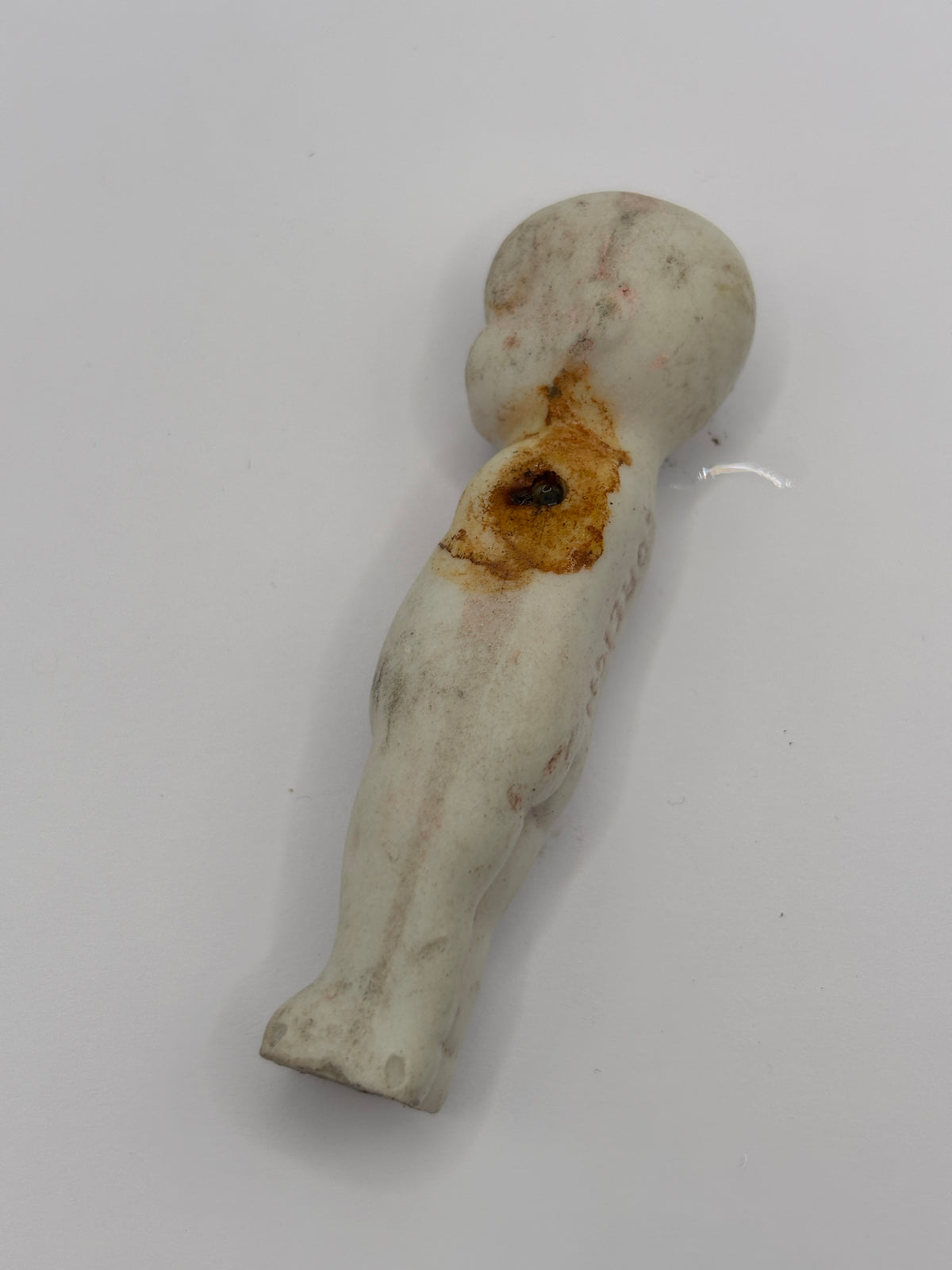 Old crusty small doll, armless
