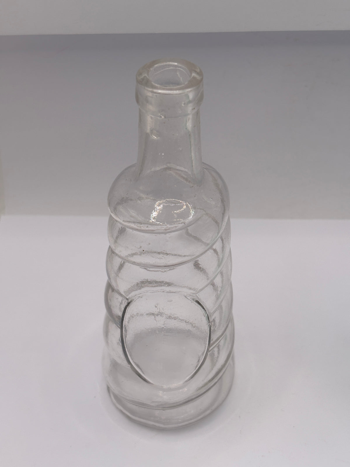 Old clear glass bottle, soda?