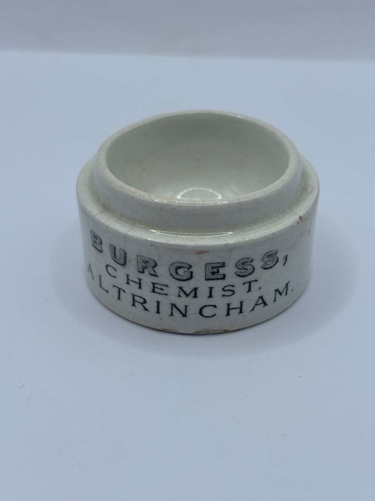 Old advertising base. Burgess chemists Altrincham