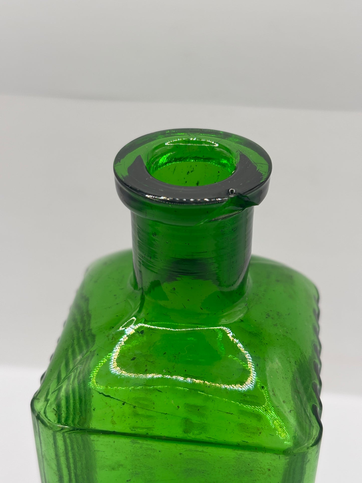 Old green glass poison bottle, Sheffield corporation poison bottle. Chipped