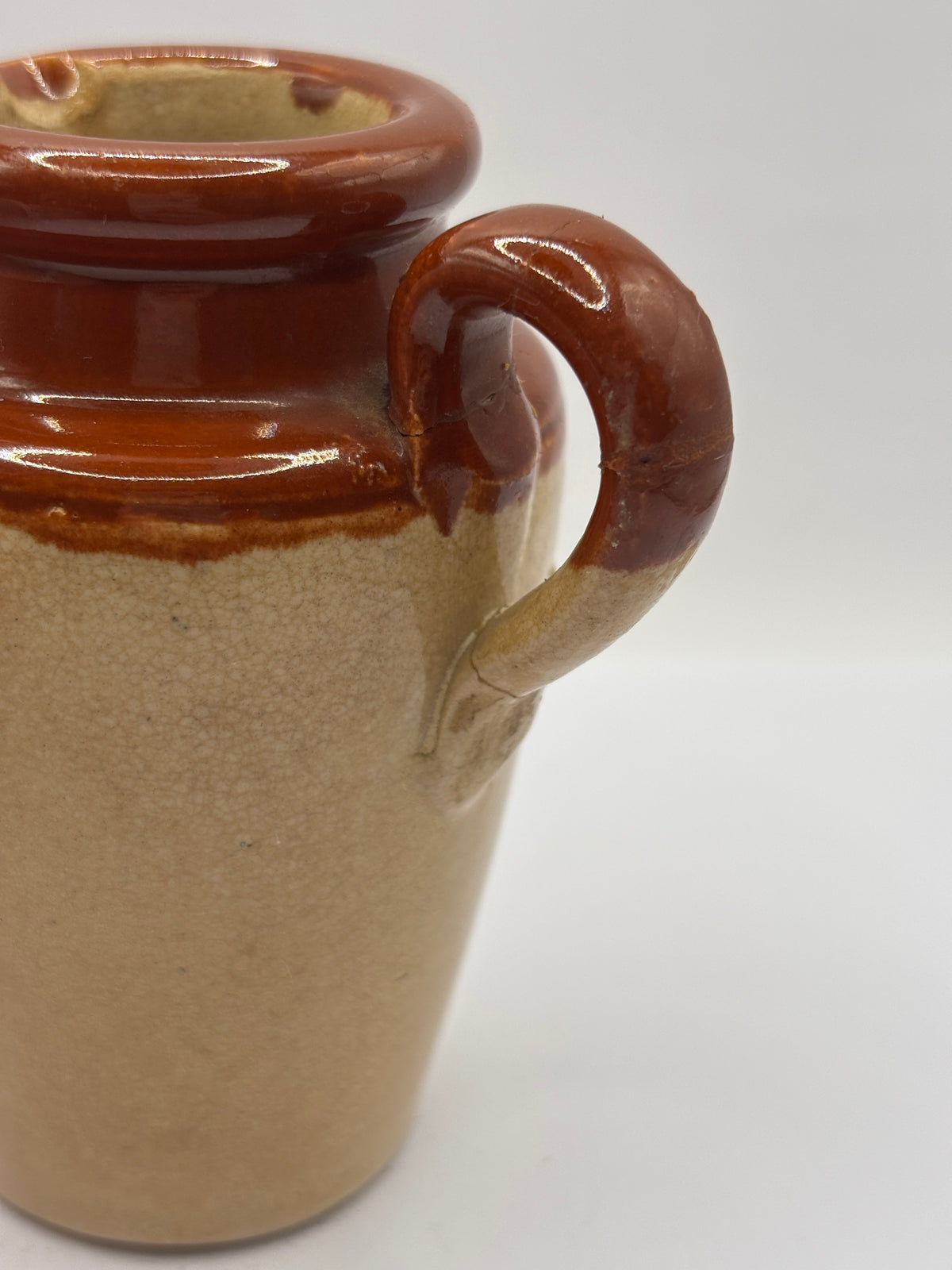 Old advertising cream pot, Bannisters Huddersfield dairies. Repaired handle