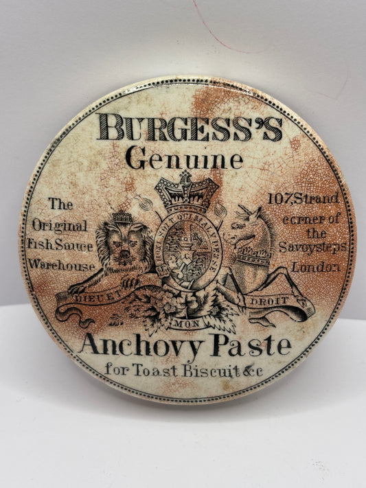 Old Burgess anchovy paste advertising pot lid, stained & crazed