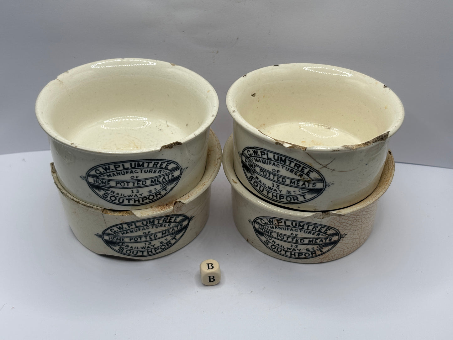 4 old advertising meat paste pots (B) damaged