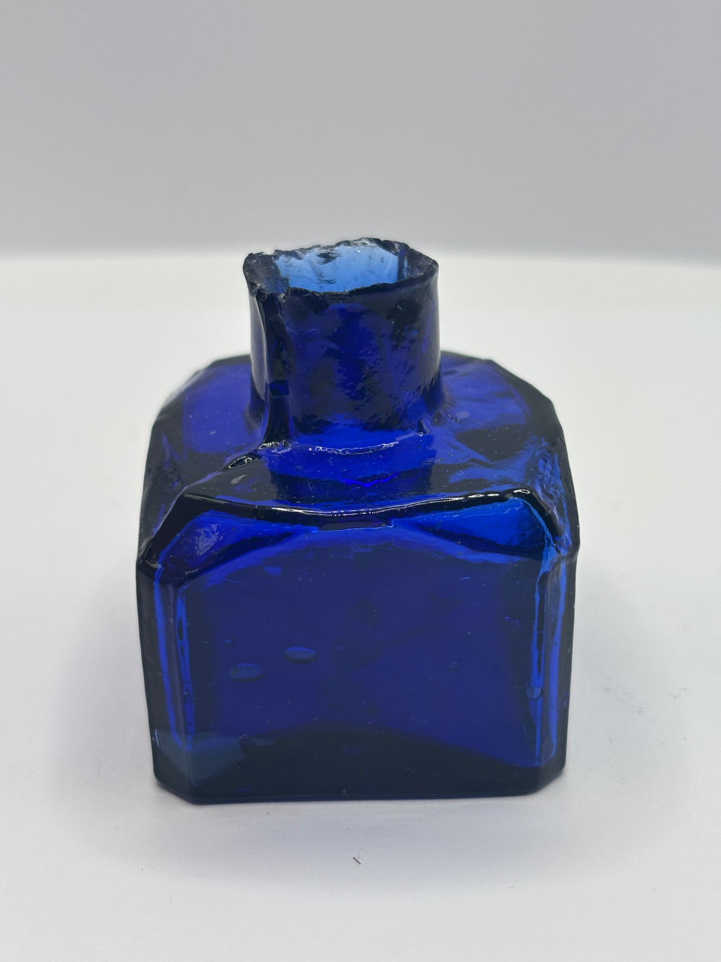 Old cobalt blue glass inkwell, ink bottle