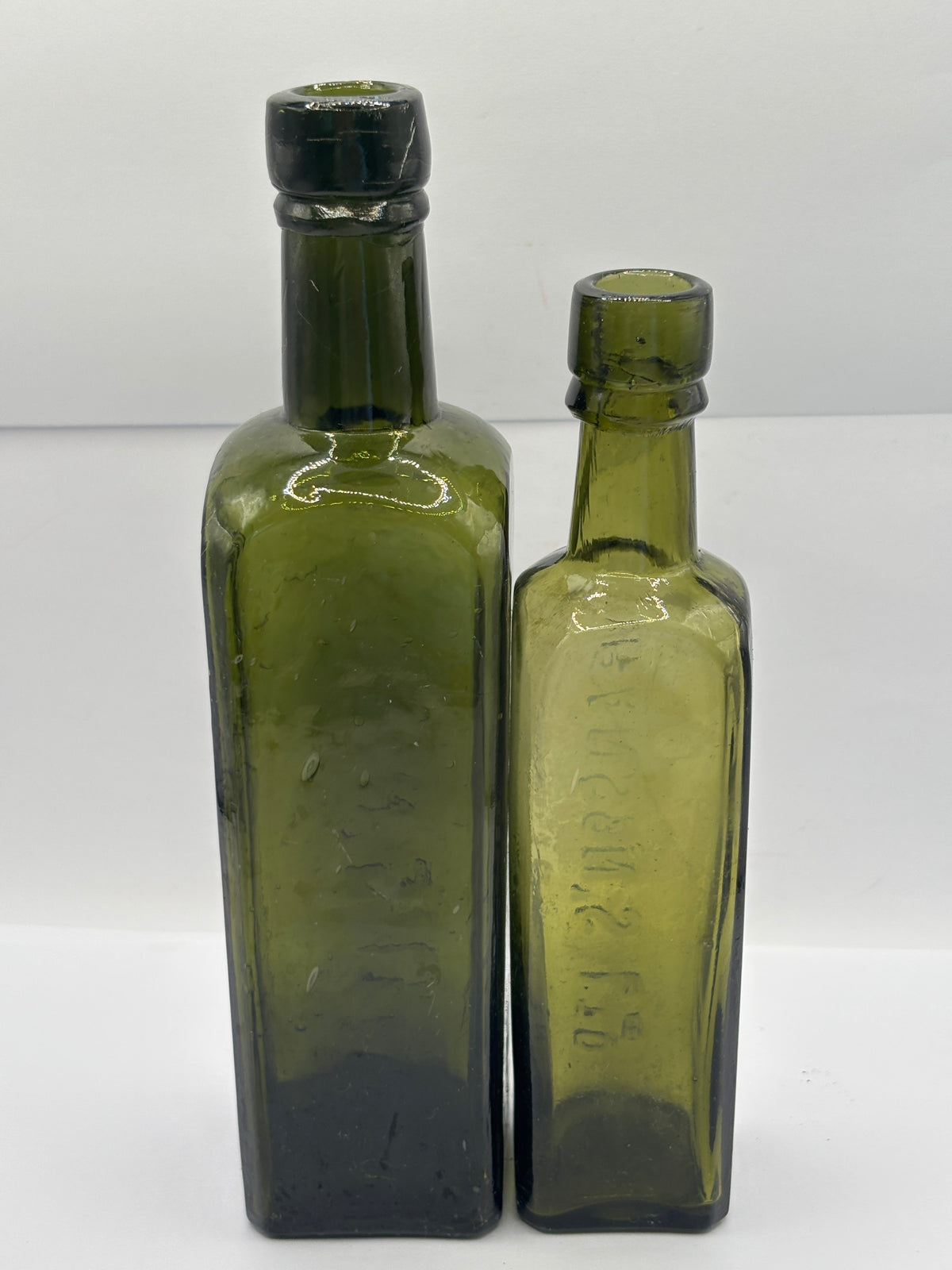 2 Old green glass Branston sauce bottles