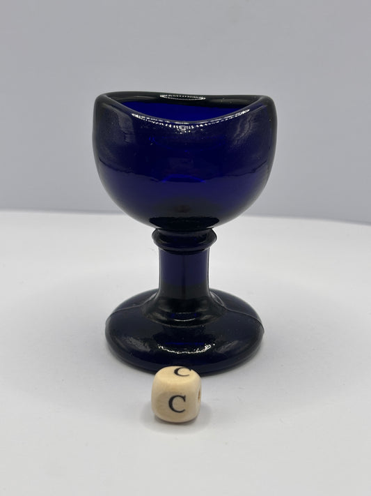 Old blue glass eye bath (c)