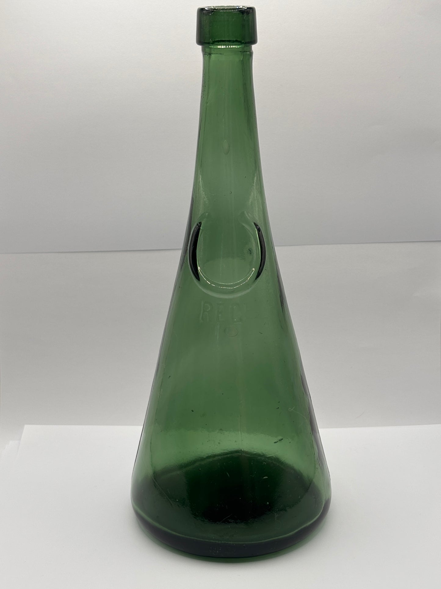 Old large dark green bottle