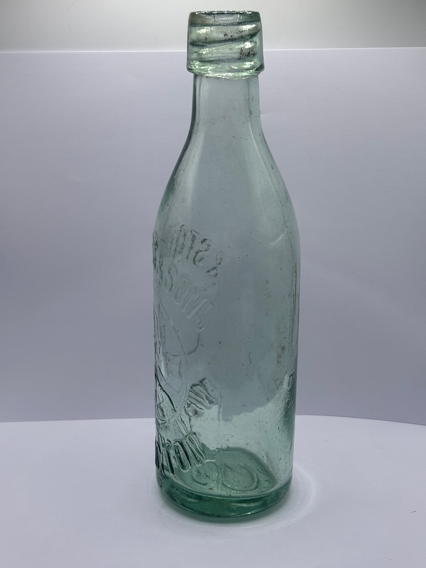 Old aqua glass Stotherts beer bottle