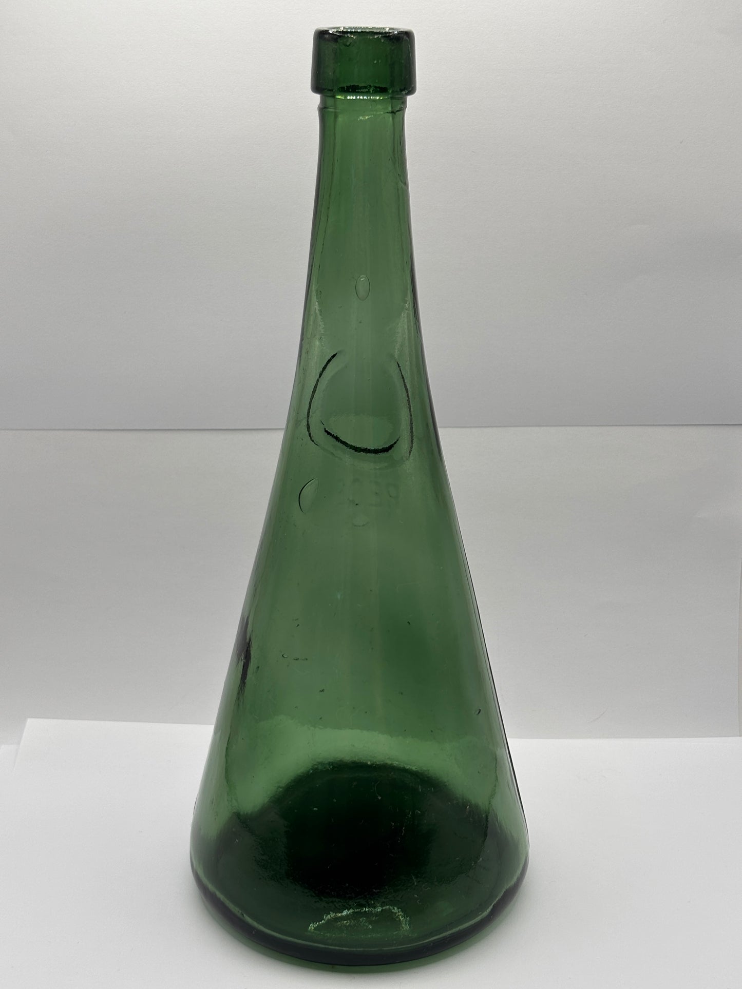 Old large dark green bottle