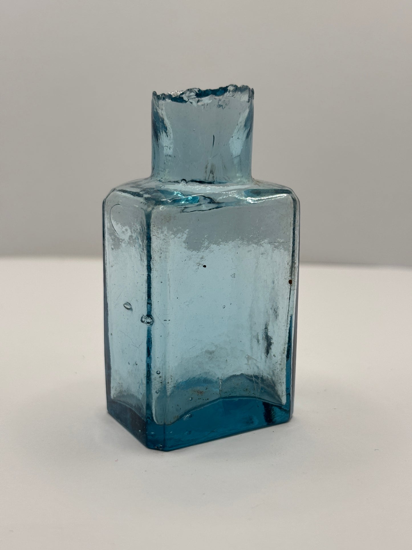 Old ice blue glass advertising ink & gum bottle, inkwell.