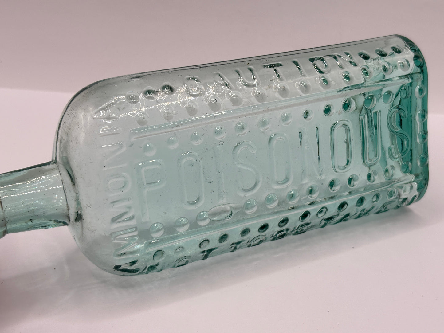 Old aqua glass poison bottle, Ammonia, caution Poisonous, not to be taken