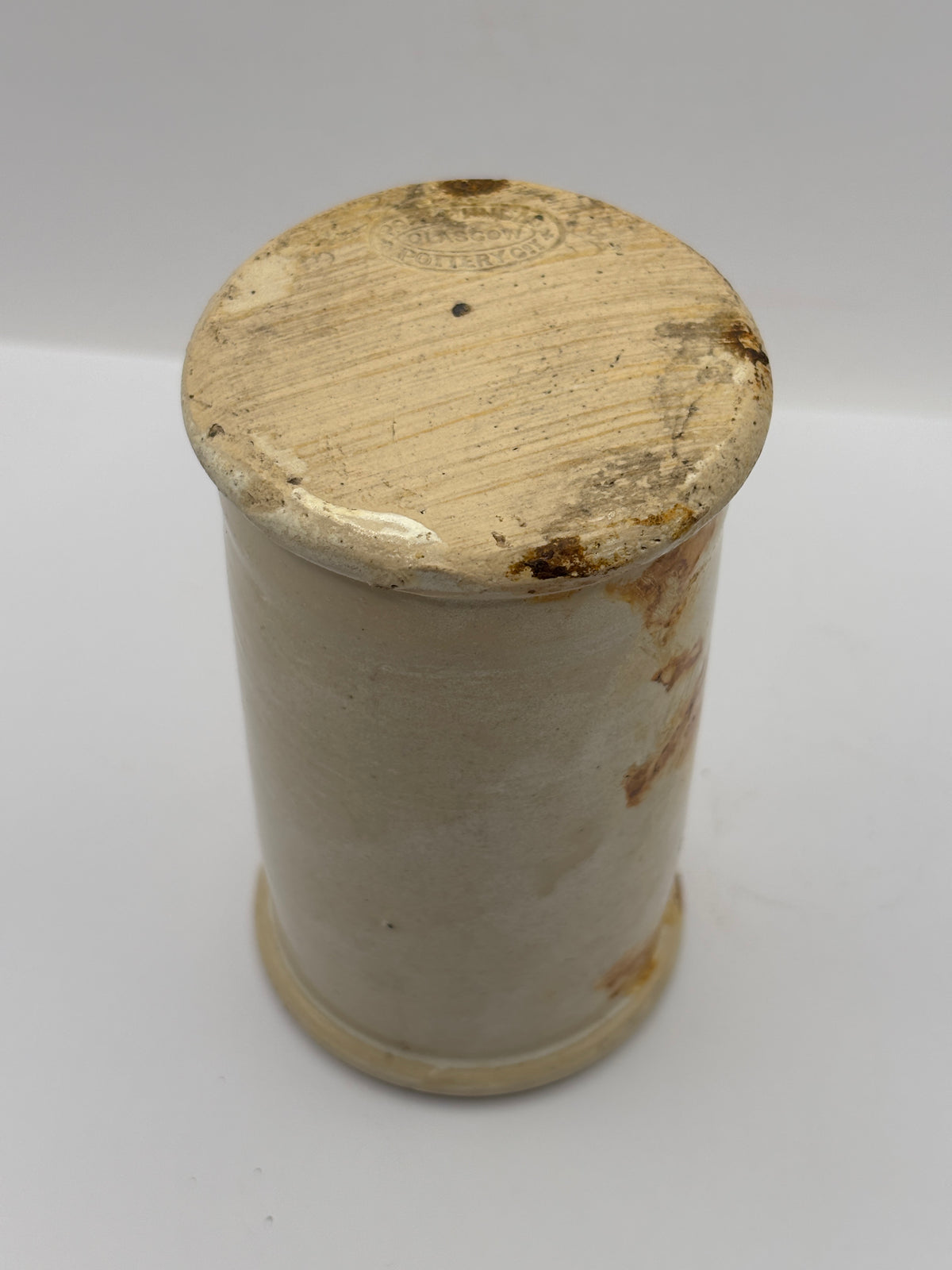 Old tall stained stoneware cream pot