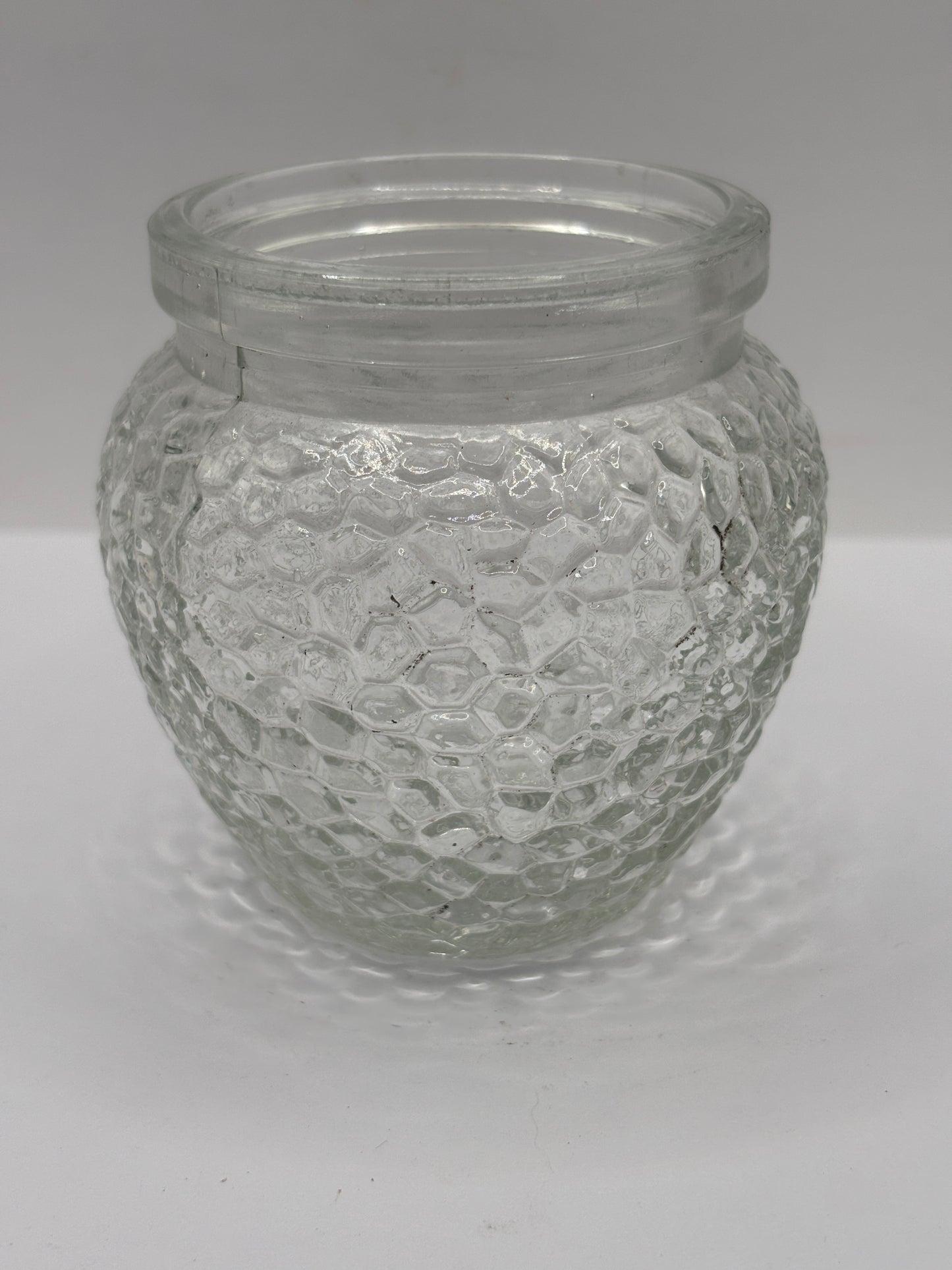 Old clear glass honey jar