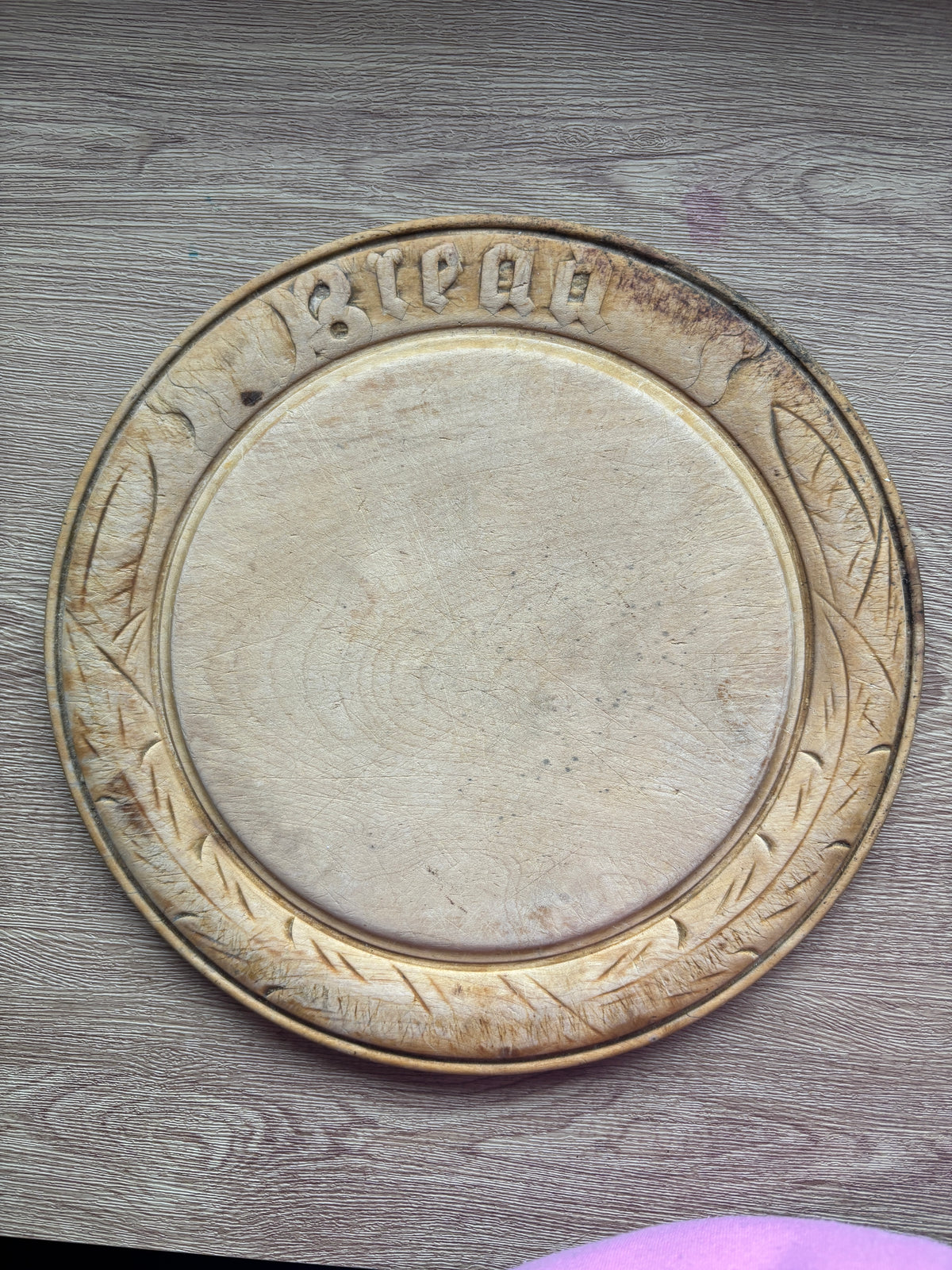 Old wooden carved bread board