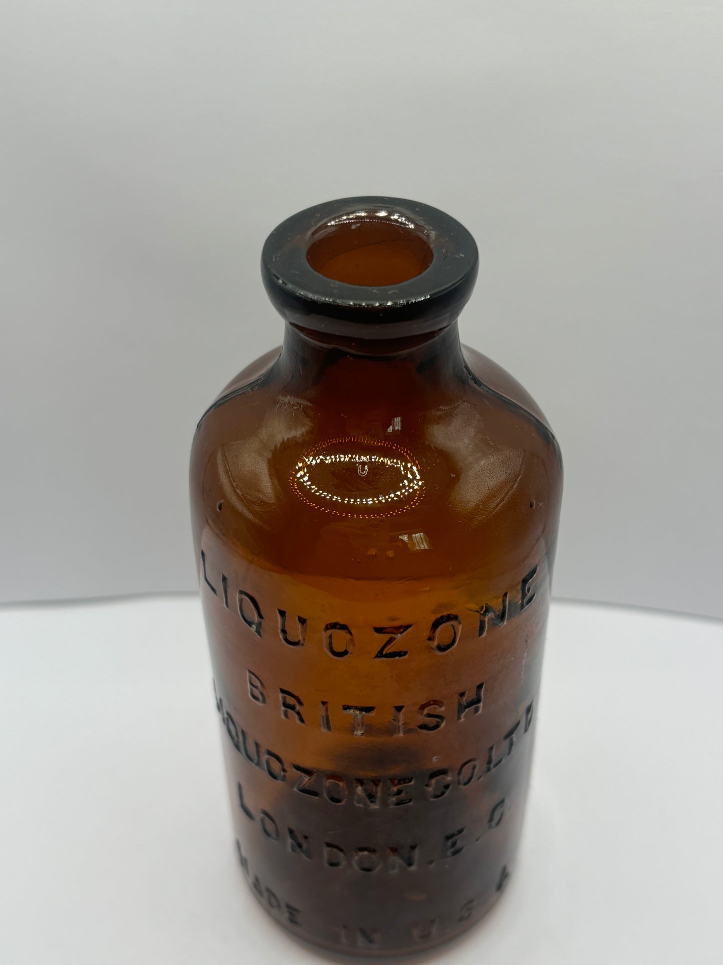 old amber glass liquozone bottle