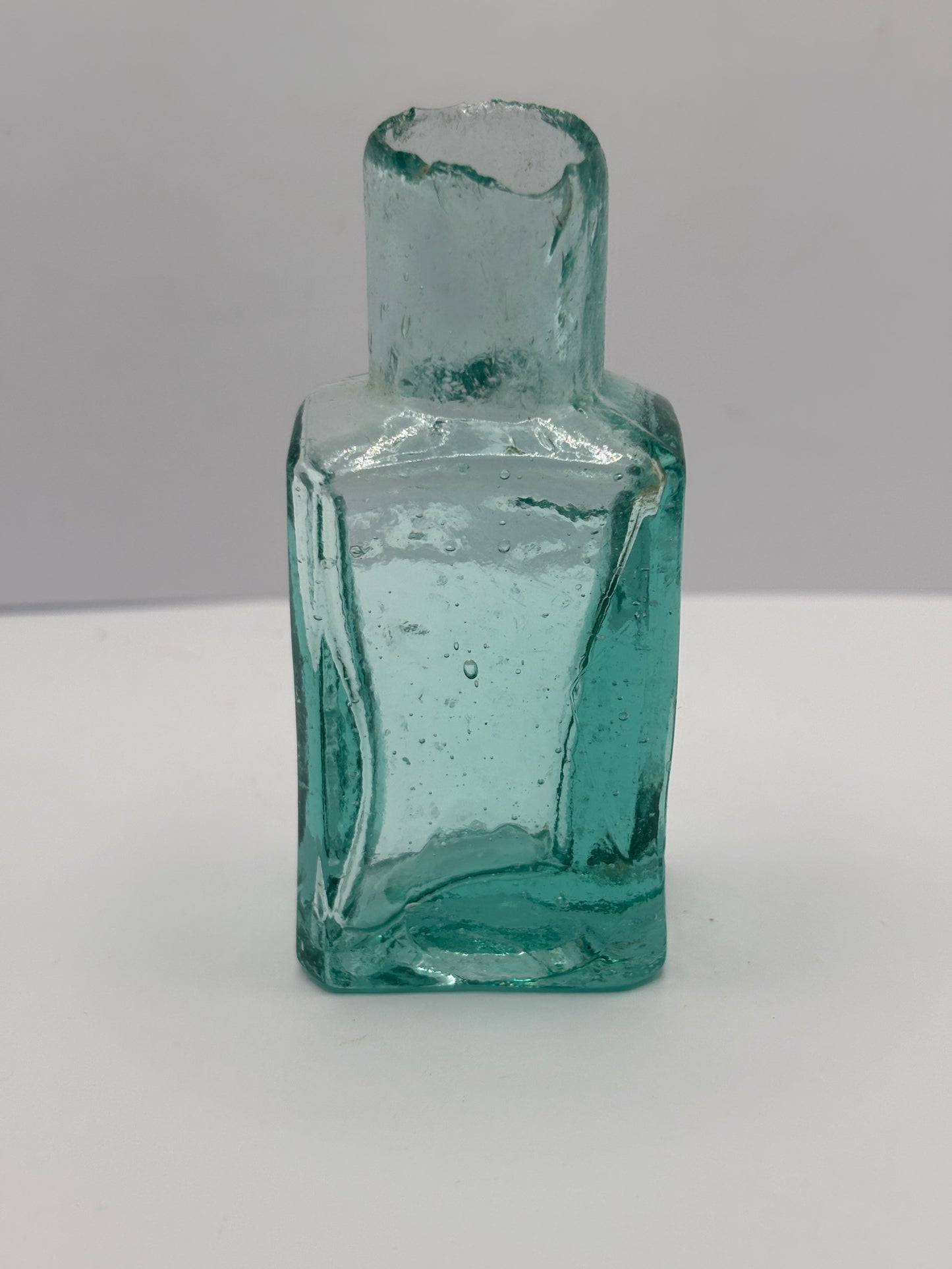 Old aqua glass advertising ink, ink bottle, inkwell. Lion brand ink